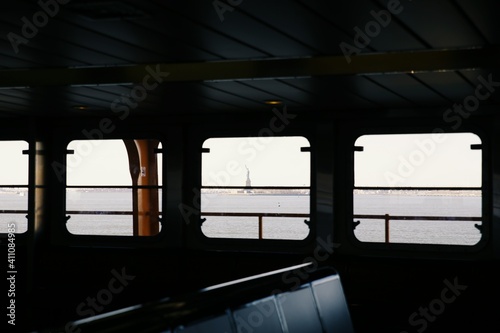 Statue Of Liberty Seen Through Boat Window