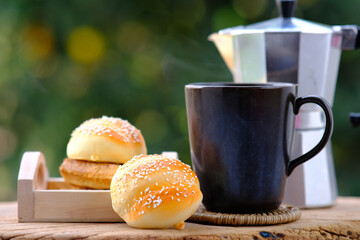 Sticker - hot coffee and tea with bakery in the morning on wood table background and space