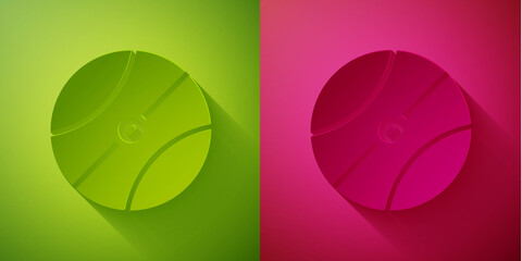 Poster - Paper cut Basketball ball icon isolated on green and pink background. Sport symbol. Paper art style. Vector.