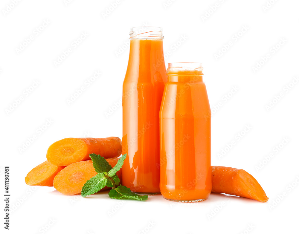 Bottles of fresh carrot juice on white background