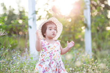 Cute girl smiling brightly in the setting sun