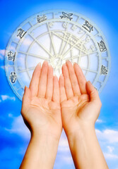 Wall Mural - beautiful woman´s hands with horoscope, zodiac ring and sky like astrology concept