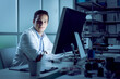 © StockPhotoPro - Young engineer working at desk
