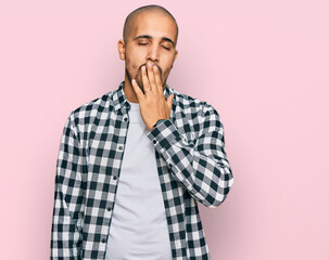 Canvas Print - Hispanic adult man wearing casual clothes bored yawning tired covering mouth with hand. restless and sleepiness.