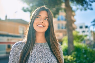 Poster - Young beautiful hispanic girl smiling happy walking at the city.