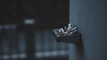 Close-up Of Cigarette In Smoking On Wall