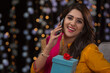 © IndiaPix - woman talking on phone with gift in hand