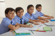 © IndiaPix - children studying in class and smiling