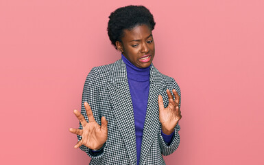 Sticker - Young african american girl wearing casual clothes disgusted expression, displeased and fearful doing disgust face because aversion reaction.