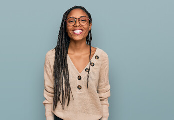 Wall Mural - African american woman wearing casual clothes with a happy and cool smile on face. lucky person.