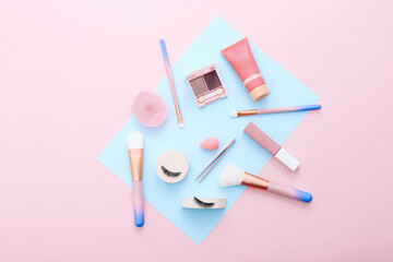 Poster - Makeup tools and accessories on blue and pink background. Beauty concept. Flat lay composition, top view