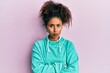© Krakenimages.com - Beautiful african american woman with afro hair wearing casual sweatshirt skeptic and nervous, disapproving expression on face with crossed arms. negative person.