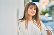 © Krakenimages.com - Caucasian sporty teenager girl smiling happy standing at the city.