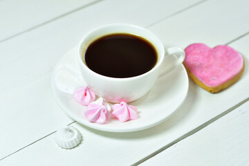 cup of coffee and gingerbread in the form of hearts. Breakfast on Valentine's Day or 8 March.