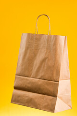 Wall Mural - Empty brown paper shopping bag with Handles.