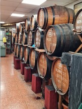 Wine Barrels In A Traditional Wine Shop, Names Chalked On The Barrels. White, Red Wine And Rosé, Tap Wine Sold In Bulk In The Traditional Way. Tarragona, Catalonia, Spain