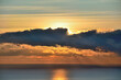 Sunrise and Sunny path on the sea.  Colorful view of the sea and sky with clouds.