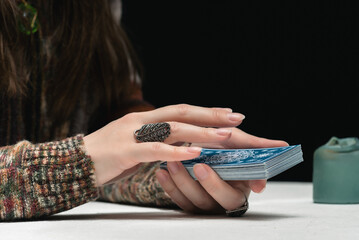 Wall Mural - Fortune teller is reading the future with tarot cards close up.