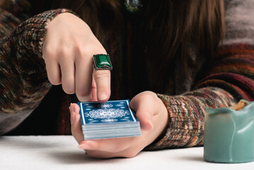 Canvas Print - Fortune teller is reading the future with tarot cards close up.