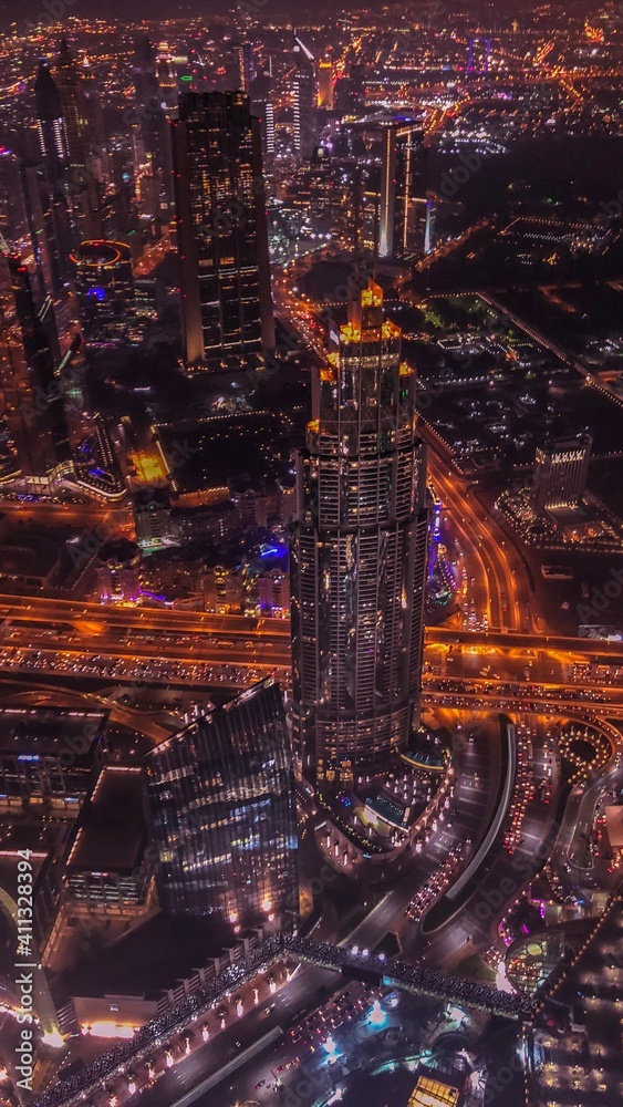 High Angle View Of City Lit Up At Night - obrazy, fototapety, plakaty 