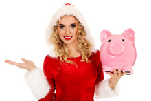 Portrait Of Woman Wearing Santa Hat While Holding Piggy Bank Against White Background