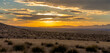 Beautiful golden orange mountain sunset sunrise over the Arizona desert, with many yucca and agave plants. Concepts of travel, vacation, nature