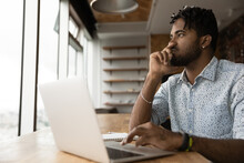 Pensive Young Afro Guy Student Take Distant Test Exam From Home Think Before Type Choose Correct Answer Online In Pc App. Black Male Specialist Create Good Cv Resume To Send Email On Job Seek Website