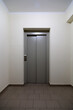 © indigolotos - Metal elevator doors in a modern building.