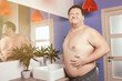 © vladorlov - Good morning and funny fat man in the bathroom.