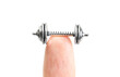 Cropped view of a tiny dumbbell on a fingertip isolated on white
