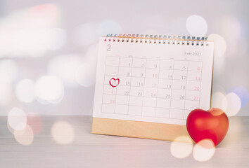 Wall Mural - Calendar and heart shape with memo 14 February Valentine day on desk, reminder for surprise of love, romance and sweet, celebration and decoration, date and planner, nobody, top view, holiday concept.