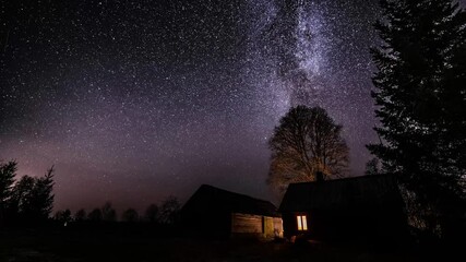 Wall Mural - milky way timelapse with stars in clear summer night. old barn house. country side. timelapse footag