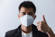 © nationkp - Asian man in black suits and white hygienic mask  protect against diseases, viruses and germs isoloated background