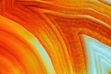 Wall Mural - Cross section of natural translucent agate crystal surface, Orange abstract structure slice mineral stone macro closeup