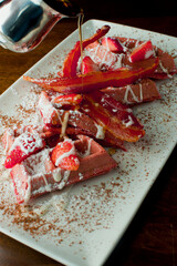 Wall Mural - French toast. Classic American restaurant breakfast or brunch favorite. Brioche toast fried in butter and served with strawberries, blackberries, whipped cream powdered sugar and maple syrup.