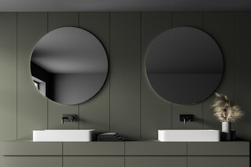 Grey and green bathroom with two sinks and mirrors