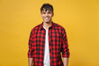 Young spanish latinos attractive handsome smiling cheerful stylish fashionable student man 20s wear red checkered shirt, white t-shirt look camera isolated on yellow color background studio portrait.