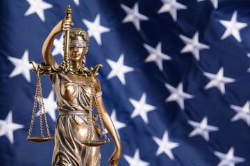 Wall Mural - The statue of justice Themis or Justitia, the blindfolded goddess of justice against the flag of the United States of America, as a legal concept