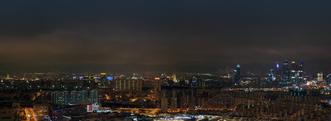 Wall Mural - Panoramic aerial view of night Moscow, Russia. Moscow City skyscrapers at night, skyline. City landscape in Russia