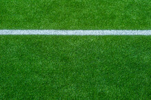 Green Synthetic Grass Sports Field With White Line Shot From Above. Soccer, Rugby, Football, Baseball Sport Concept