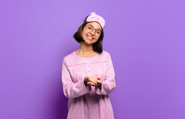 Canvas Print - young hispanic woman smiling happily with friendly, confident, positive look, offering and showing an object or concept