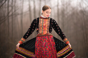 slovak folklore. traditional folk costume. beautiful folk dancer in winter.