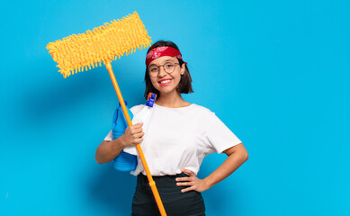 Poster - young latin woman smiling happily with a hand on hip and confident, positive, proud and friendly attitude