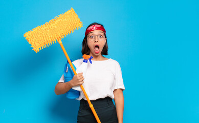 Canvas Print - young latin woman looking very shocked or surprised, staring with open mouth saying wow