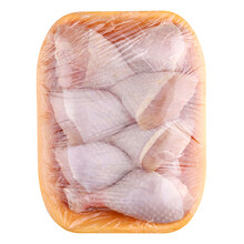 Raw And Uncooked Chicken Drumsticks In A Yellow Plastic Container. Meat Of Poultry In Tray, Isolated On White Background. Top View