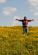 © Michalis Palis - Happy girl and a field with yellow flowers in spring
