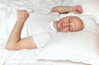 © mark_gusev - Bald man in his 40s in white shirt sleeps in his bed. Adult bedtime and rest concept