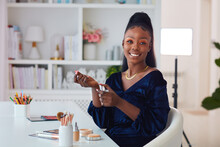 Beautiful Young African American Woman Applying A Perfume Fragrance At Home, Beauty Blogger
