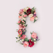 Letter C made of real natural flowers and leaves. Flower font concept. Unique collection of letters and numbers. Spring, summer and valentines creative idea.