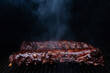 Hot babyback ribs cooking on a pellet smoker grill with caramelized barbecue sauce slathered on top. 